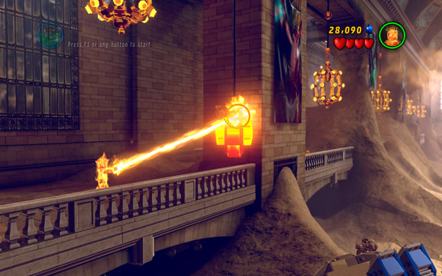 Enter to the station and then choose Human Torch - fly to the balcony on the left side of the building and melt the golden device attached to the pillar, using fire beam - Sand Central Station - Minikit Sets - LEGO Marvel Super Heroes - Game Guide and Walkthrough