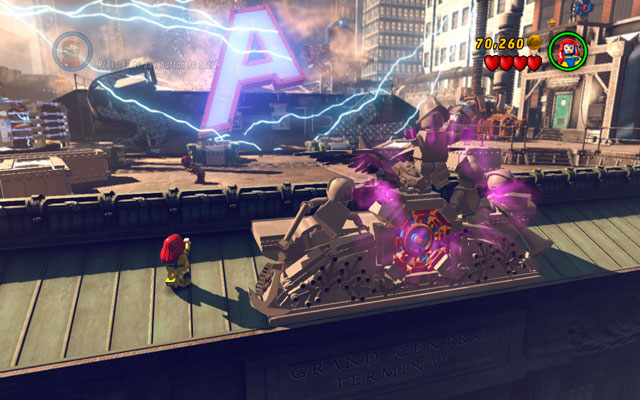 During the first stage of the boss fight turn your character back and approach to the big clock, located on the top of the building - Sand Central Station - Minikit Sets - LEGO Marvel Super Heroes - Game Guide and Walkthrough