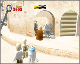 When you reach the square, you'll have to use the parts around to build an AT-ST walker - Mos Eisley Spaceport - Story Mode - Episode IV - LEGO Star Wars II: The Original Trilogy - Game Guide and Walkthrough