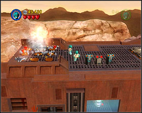 When you get on the roof of Sandcrawler use Detonators to destroy silver things on the back of vehicle. Then two players must stand on the two spots - Through the Jundland Wastes - Freeplay Mode - Episode IV - LEGO Star Wars II: The Original Trilogy - Game Guide and Walkthrough