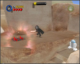 On the roof of one of the buildings on the right side of the street there's a Dark Side grid - Mos Eisley Spaceport - Freeplay Mode - Episode IV - LEGO Star Wars II: The Original Trilogy - Game Guide and Walkthrough