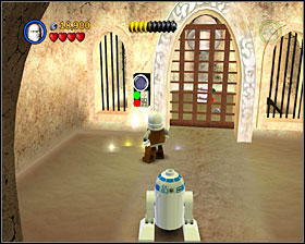 At the end of the first corridor, before the first bounty hunter door, turn right and use the 3PO panel - Jabba's Palace - Freeplay Mode - Episode VI - LEGO Star Wars II: The Original Trilogy - Game Guide and Walkthrough