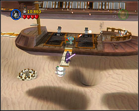 On the second skiff you'll see a plank pointing down - walk it and as R2 hover for the minikit - The Great Pit of Carkoon - Freeplay Mode - Episode VI - LEGO Star Wars II: The Original Trilogy - Game Guide and Walkthrough