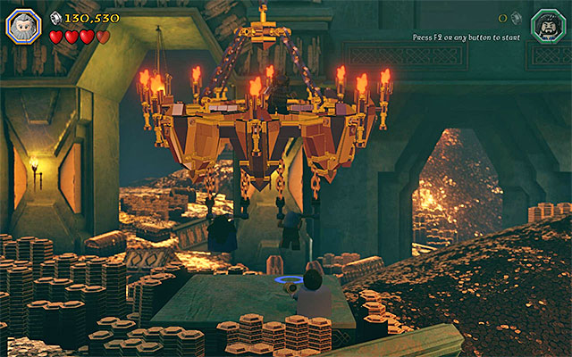 Jump towards the handles, thanks to which the chandelier will break loose - Stage 1 (Greatest Kingdom in Middle-Earth): Smaugs attack - Walkthrough - LEGO The Hobbit - Game Guide and Walkthrough