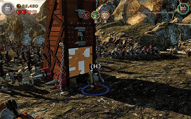 Use team action to destroy one of the walls of the siege tower - Stage 3 (Azog the Defiler): The battle with the Orcs - Walkthrough - LEGO The Hobbit - Game Guide and Walkthrough