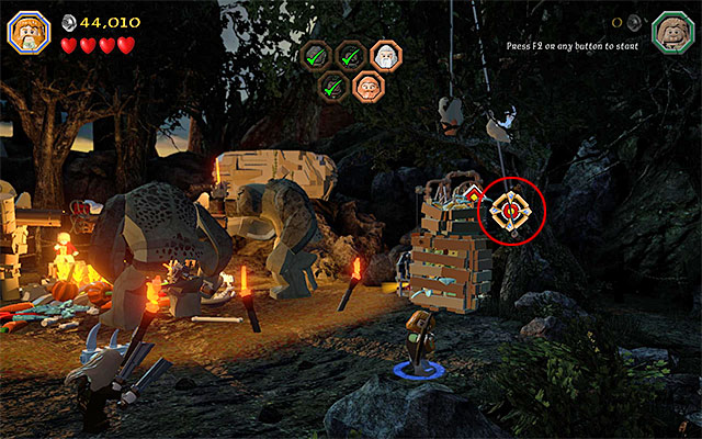 Find a Bow lying on the ground, pick it up (any character) and go towards the right side of the camp - Stage 4 (Roast Mutton): Rescue the allies - Walkthrough - LEGO The Hobbit - Game Guide and Walkthrough