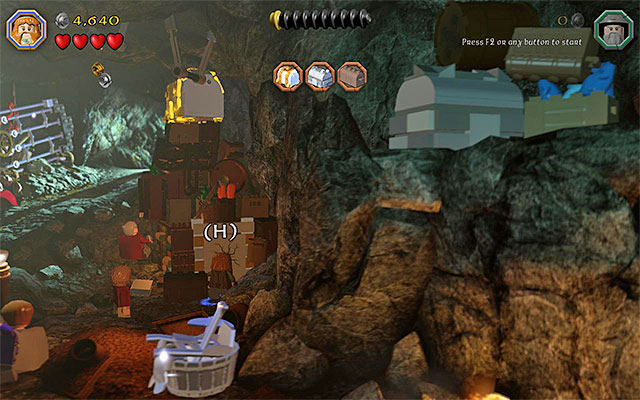 Start exploring the troll cave, where there are three chests with elven swords hidden (initially, you can play as any of the characters) - Stage 5 (The Troll Hoard): Explore the cave - Walkthrough - LEGO The Hobbit - Game Guide and Walkthrough