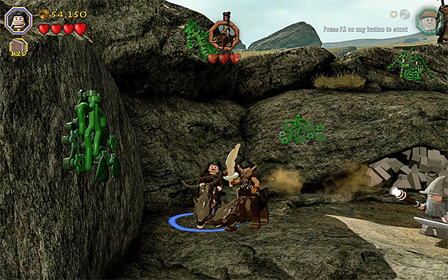 You can mount the warg and eliminate the orcs this way - Stage 5 (The Troll Hoard): The orc encounter - Walkthrough - LEGO The Hobbit - Game Guide and Walkthrough
