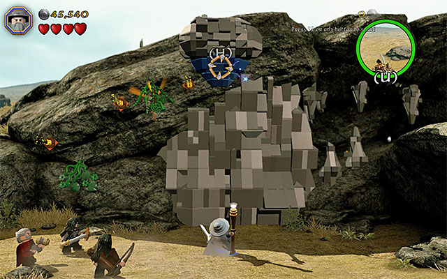 You need to aim the staff at the blue object above - Stage 5 (The Troll Hoard): The orc encounter - Walkthrough - LEGO The Hobbit - Game Guide and Walkthrough