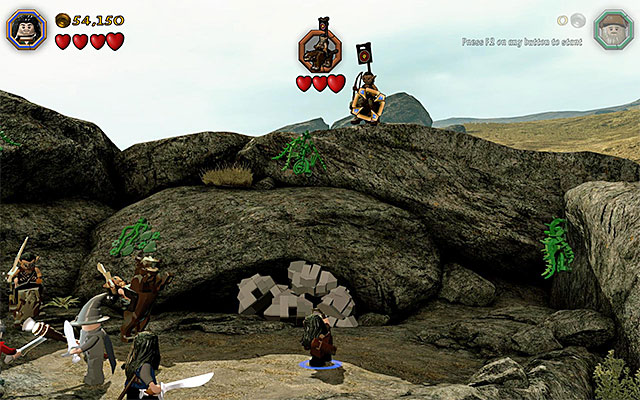 If you have completed Radagasts chase scene, then there will soon appear the orc leader, above the field, and he is a mini-boss - Stage 5 (The Troll Hoard): The orc encounter - Walkthrough - LEGO The Hobbit - Game Guide and Walkthrough