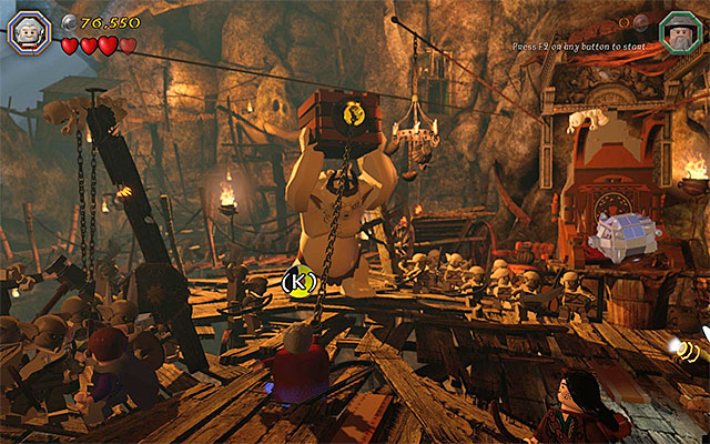 You need to use the flail on the crates catch - Stage 7 (Goblin-town): The first battle with Great Goblin - Walkthrough - LEGO The Hobbit - Game Guide and Walkthrough