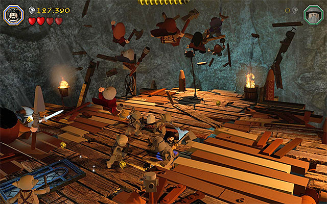 Attack the goblins and avoid stepping on the lest stable elements of the platform - Stage 7 (Goblin-town): The second battle with Great Goblin - Walkthrough - LEGO The Hobbit - Game Guide and Walkthrough