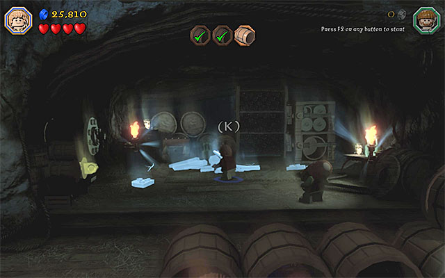 You need to put on the ring and hold down the building key - Stage 11 (Barrels Out of Bond): The cellar - Walkthrough - LEGO The Hobbit - Game Guide and Walkthrough