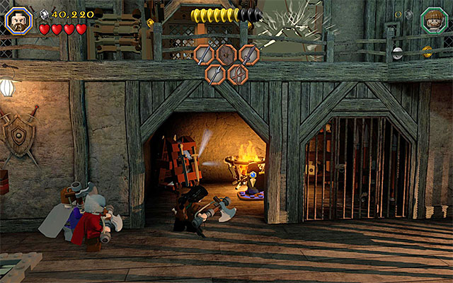 The area that you need to illuminate with a torch - Stage 12 (A Warm Welcome): The armory - Walkthrough - LEGO The Hobbit - Game Guide and Walkthrough