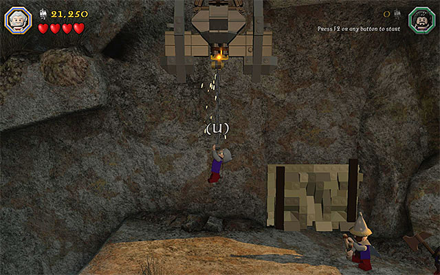 Go left and stop only after you reach the interactive catch shown in the above screenshot - Stage 15 (On the Doorstep): The climb - Walkthrough - LEGO The Hobbit - Game Guide and Walkthrough