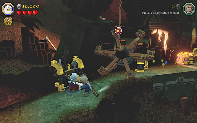 After you destroy the weapon stand, you will be able to collect the bow - Stage 16 (Inside Information): The vault - Walkthrough - LEGO The Hobbit - Game Guide and Walkthrough