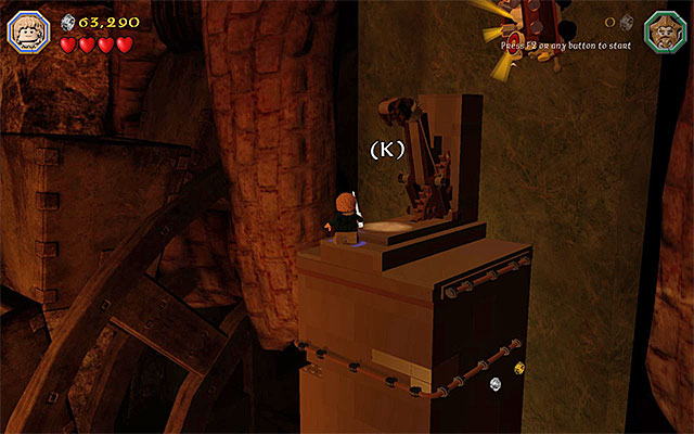 You need to reach the very top of the structure and press the appropriate button - Stage 16 (Inside Information): Defeat Smaug - Walkthrough - LEGO The Hobbit - Game Guide and Walkthrough