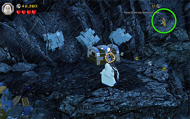 Aim Sarumans staff at the padlock on the chest - Stage 6 (Over Hill and Under Hill) - Main Stages - Collectibles - LEGO The Hobbit - Game Guide and Walkthrough