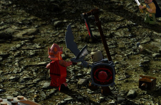 To defeat a shielded enemy, you have to keep attacking him until he lets go off his shield and afterwards attack him once again to finish him off - Prologue - Walkthrough - Act I - LEGO The Lord of the Rings - Game Guide and Walkthrough