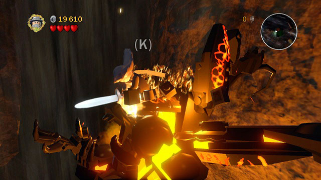 After a couple hits you will have to press (K) to lead out a more powerful attack, after which you will be thrown into the air - The Mines of Moria - Walkthrough - Act I - LEGO The Lord of the Rings - Game Guide and Walkthrough