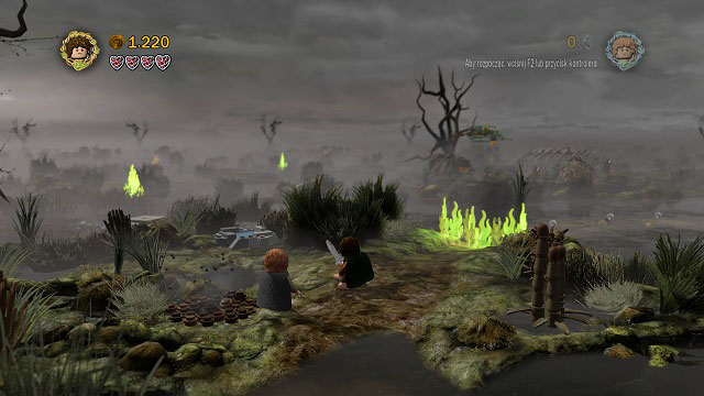 After crossing the marshes onto the next island, Gollum will show you a safe path, but unfortunately fire will block it - The Dead Marshes - Walkthrough - Act II - LEGO The Lord of the Rings - Game Guide and Walkthrough