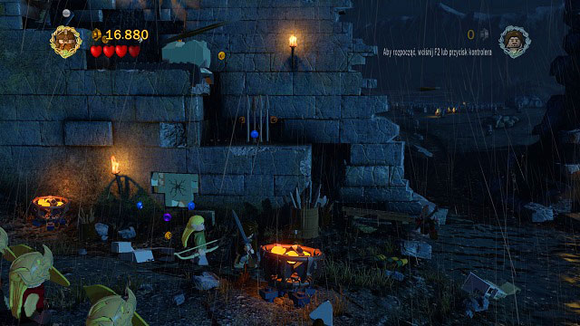 Use Gimli's help to break the cracked brick found on the wall - Helm's Deep - Walkthrough - Act II - LEGO The Lord of the Rings - Game Guide and Walkthrough