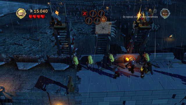 During the last wave you will have to throw Gimli at the cracked brick and shoot down two Orcs with Legolas' bow - Helm's Deep - Walkthrough - Act II - LEGO The Lord of the Rings - Game Guide and Walkthrough