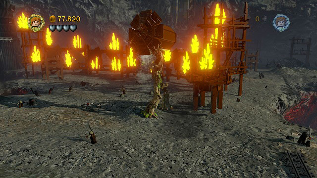 Keep going further to the right and you should reach a wall of fire - Osgiliath - Walkthrough - Act II - LEGO The Lord of the Rings - Game Guide and Walkthrough