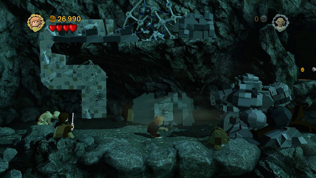 As Gollum, destroy the spider-webs on the wall and climb onto the rock ledge above you - The Secret Stairs - Walkthrough - Act III - LEGO The Lord of the Rings - Game Guide and Walkthrough