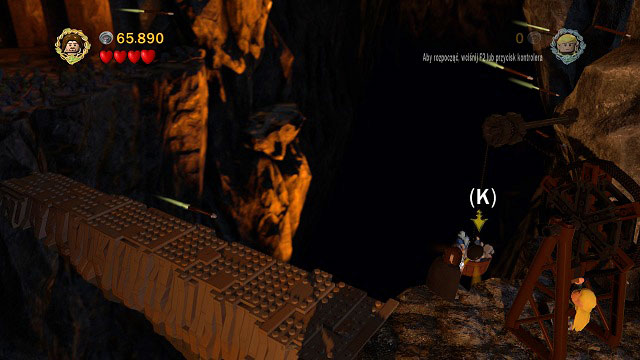 Right after Gandalf's fight with Balrog, you will end up beside a crane - one character should grab onto the handle and pull out a bucker with the item, while the second pick up the treasure - The Mines of Moria - Collectibles - LEGO The Lord of the Rings - Game Guide and Walkthrough