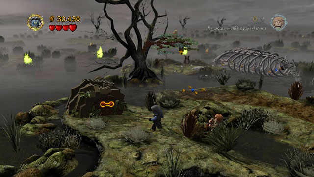 On the island before the first wall of fire, to the left of the giant skeleton you should see a cage with an orange handle - The Dead Marshes - Collectibles - LEGO The Lord of the Rings - Game Guide and Walkthrough
