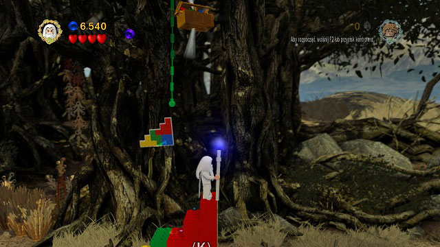 Head to the top, grab onto the liana and climb up to the chest - Track Hobbits - Collectibles - LEGO The Lord of the Rings - Game Guide and Walkthrough