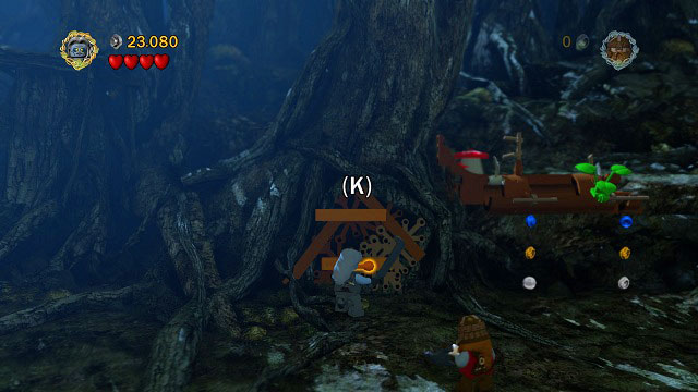 After destroying the rocks blocking the path and dealing with the attacking Orcs, you should see an orange handle in the distance - Track Hobbits - Collectibles - LEGO The Lord of the Rings - Game Guide and Walkthrough