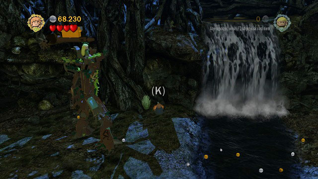 To the left of the waterfall you should find a location where you have to put a plant - Track Hobbits - Collectibles - LEGO The Lord of the Rings - Game Guide and Walkthrough