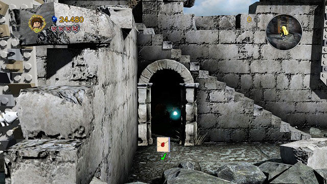 Right after freeing Gollum, below the stairs on the right you will find a dark room - Osgiliath - Collectibles - LEGO The Lord of the Rings - Game Guide and Walkthrough