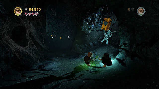 Use the climbing wall and cross the narrow tunnel to see a chest in a spider-web above you - Secret Stairs - Collectibles - LEGO The Lord of the Rings - Game Guide and Walkthrough