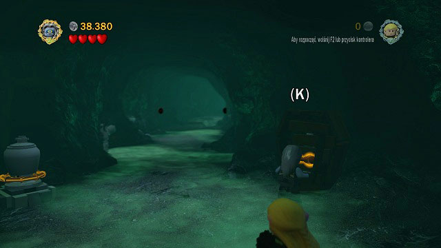 After leaving the second big cave, as you're going deeper into the corridor, on the right side you should see an orange handle - The Paths of the Dead - Collectibles - LEGO The Lord of the Rings - Game Guide and Walkthrough
