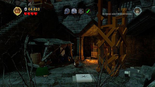 In the right side of the location, behind and Orc throwing barrels you will find a cracked tile - Cirith Ungol - Collectibles - LEGO The Lord of the Rings - Game Guide and Walkthrough