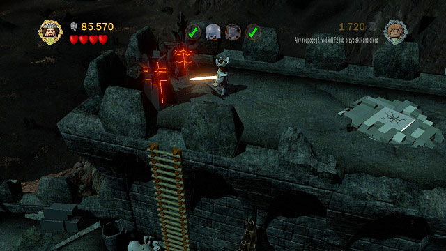 Above the Orc controlling the gate, in the location where you assemble the hammer, there are two LEGO Morgul bricks - Cirith Ungol - Collectibles - LEGO The Lord of the Rings - Game Guide and Walkthrough