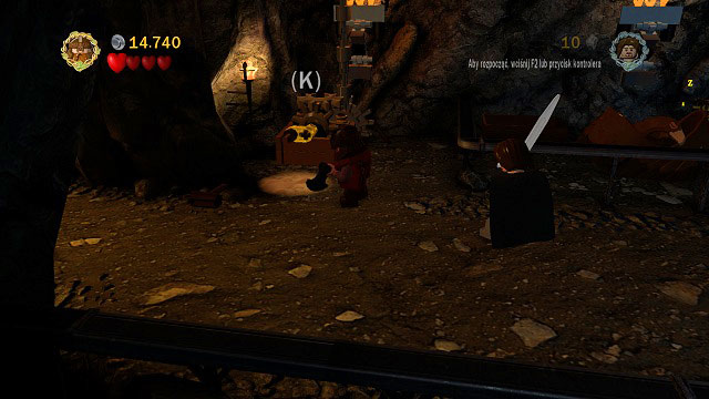 Inside, destroy all the chests and barrels on the left side of the cave and use the crank - The Black Gate - Collectibles - LEGO The Lord of the Rings - Game Guide and Walkthrough