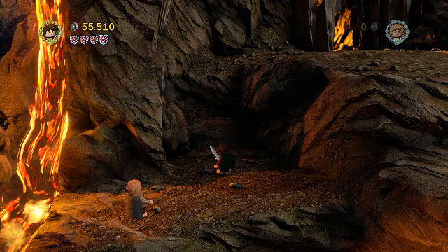 From the place where you found the treasure, head further to the right and north - climb up the rock ledges (start with the lower one, jump to the left to the one with a stream of steam and from there to the very top) towards the door to Mount Doom - Mount Doom - Collectibles - LEGO The Lord of the Rings - Game Guide and Walkthrough