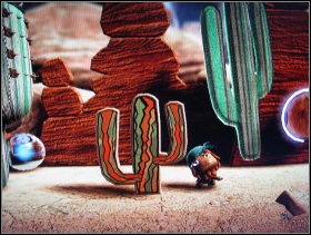 Drop the stacked objects and use them to jump above the spikes and collect the Brown Stripy Fabric - The Canyons - Boom Town - The Canyons - LittleBigPlanet - Game Guide and Walkthrough