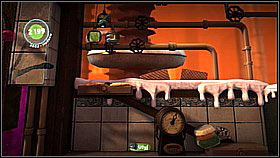 Behind the waterfall, use another balance/catapult - The Cakeinator - Victoria's Laboratory - LittleBigPlanet 2 - Game Guide and Walkthrough