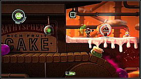 After collecting the bubbles, fall down and shoot a cake below - try to collect the key and items attached to the ceiling (look out for the jam, is it can be annoying - remember you can destroy it with cakes, which makes things easier) - The Cakeinator - Victoria's Laboratory - LittleBigPlanet 2 - Game Guide and Walkthrough