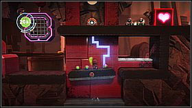 Before you activate the second hologram box, lower the footbridge by grabbing the sponge below it - Bang for Buck - p. 1 - The Factory of a Better Tomorrow - LittleBigPlanet 2 - Game Guide and Walkthrough