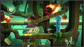A bit further collect the item hidden behind the drop [1] and afterwards fill it up to drop down the burning boulder - Patients Are a Virtue - Eve's Asylum - LittleBigPlanet 2 - Game Guide and Walkthrough