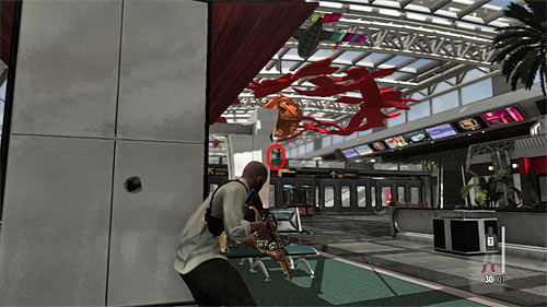 During travelling the first part of a terminal watch out for an enemy standing on the far bridge (screen) - Chapter XIV - p. 2 - Walkthrough - Max Payne 3 - Game Guide and Walkthrough