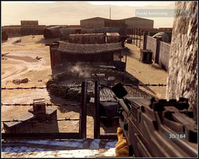 Replenish your ammo and kill the enemies hidden behind the blue fence [1] - Breaking Bagram - p. 2 - Walkthrough - Medal of Honor - Game Guide and Walkthrough