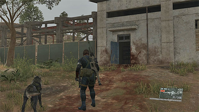 The entrance to the main building in the Industrial Zone. - Locating Shabani - Mission 20 - Voices - Metal Gear Solid V: The Phantom Pain - Game Guide and Walkthrough