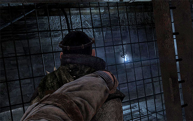 Destroy the lamp you can see in the distance and come closer to the guard crouching over the fire - Find the switch to lift the gate back out of the way - Chapter 13: Bandits - Metro: Last Light - Game Guide and Walkthrough